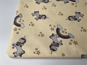 Patchwork stof (prøvetryk) - små søde enhjørninger på gullig nude bund, 275 cm